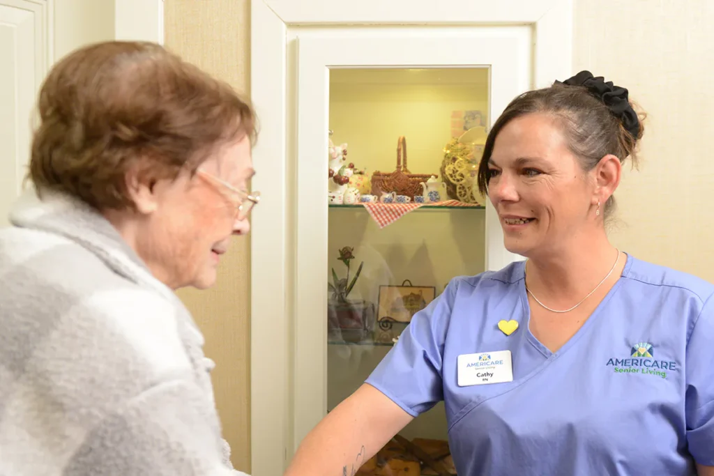 nurse smiling at resident